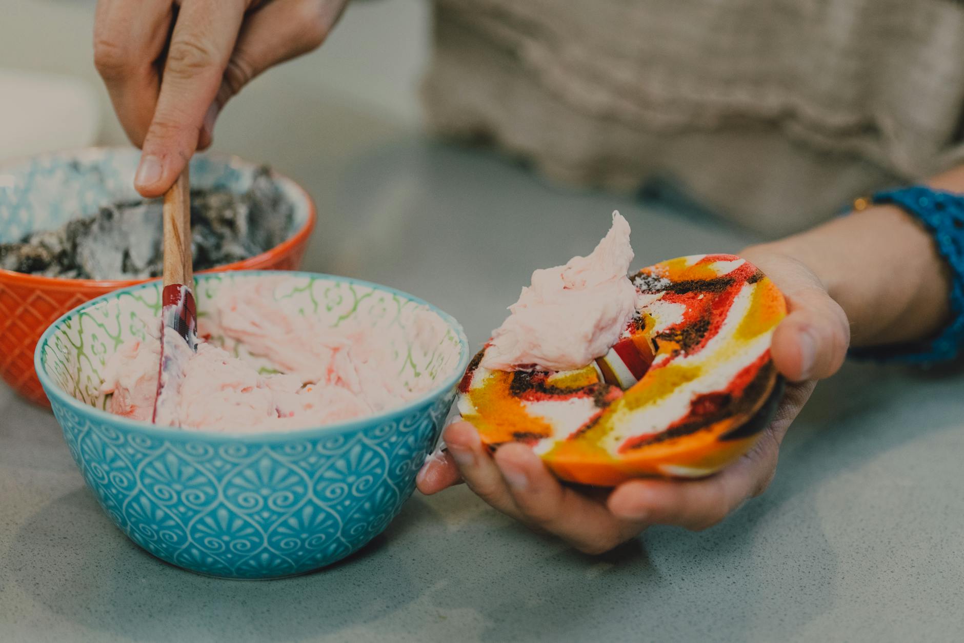 close up shot of a person making a bagel ice cream